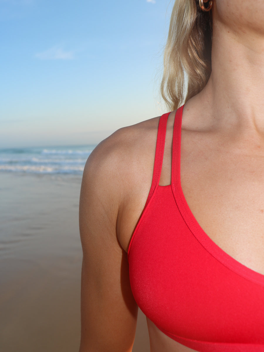 Close view of JAYD Swimwear Tazzie athletic bikini top in Ruby Red
