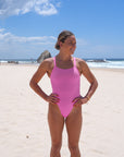 Front view of Apsley One Piece Athletic Swimsuit in Fairy Floss Pink by JAYD Swimwear