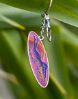 JAYD Swimwear keyring featuring a woman diving into the water with the phrase 'dive in with confidence' on a colourful ink surfboard shape.