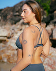 Fixed-back design of the JAYD Kiama bikini top in carbon with cross-back straps for optimal support.