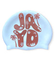 White Island Palms JAYD swim cap in cacao, featuring palm trees, starfish, shells & other ocean illustrations