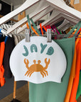 Feeling crabby? This JAYD Swim Cap is here to lift your mood with a unique crab design that matches out Matcha, Sunshine or Cove One Piece swimsuits.
