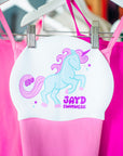 Blue and pink unicorn with JAYD Swimwear writing on a swim cap.