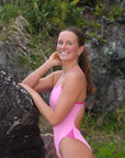 Get ready to strut your stuff in JAYD Swimwear's Zambia Fairy Floss One Piece, featuring bold contrasting pink sorbet shoulder straps and side cutouts.