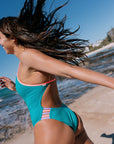 Woman in a Atlantic one piece with contrast detailing on the hip