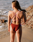 Athlete wearing the IBIZA chlorine resistant one piece designed by JAYD Swimwear in the colour Cinnamon. Swimsuit is double lined and built for performance.