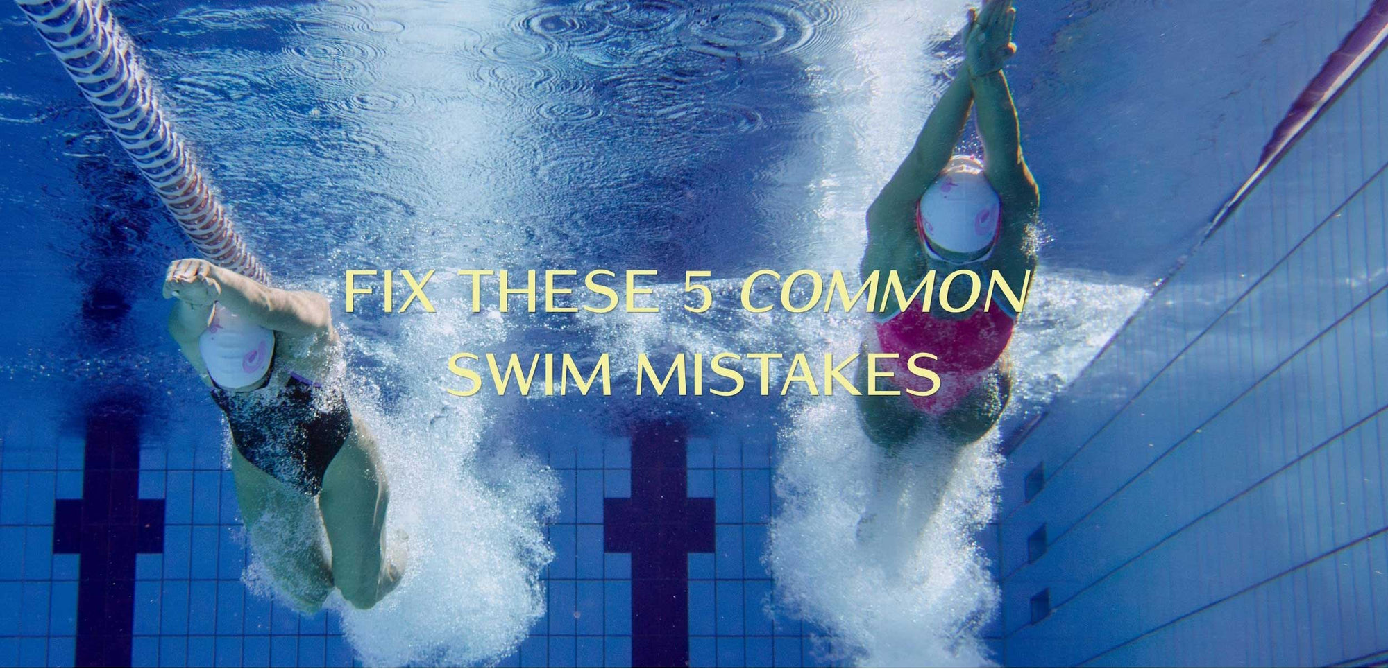 Female swimmer performing freestyle stroke in a pool, demonstrating correct arm pull technique for competitive swimming training