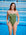 JAYD model Dom standing in front of a pool wearing the Albi one piece in Olive green with contrasting Neon orange straps.