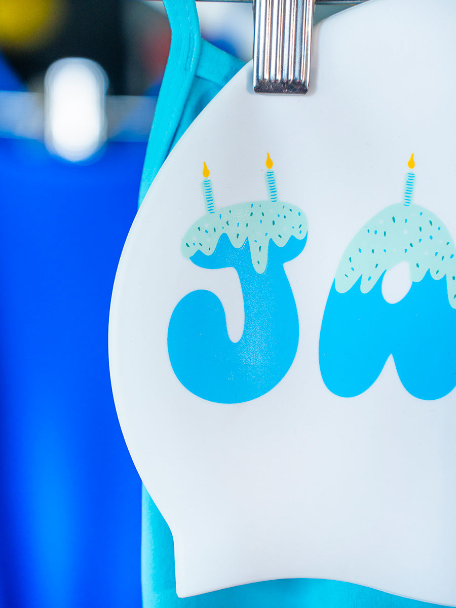 JAYD swim cap design with candles and icing graphic