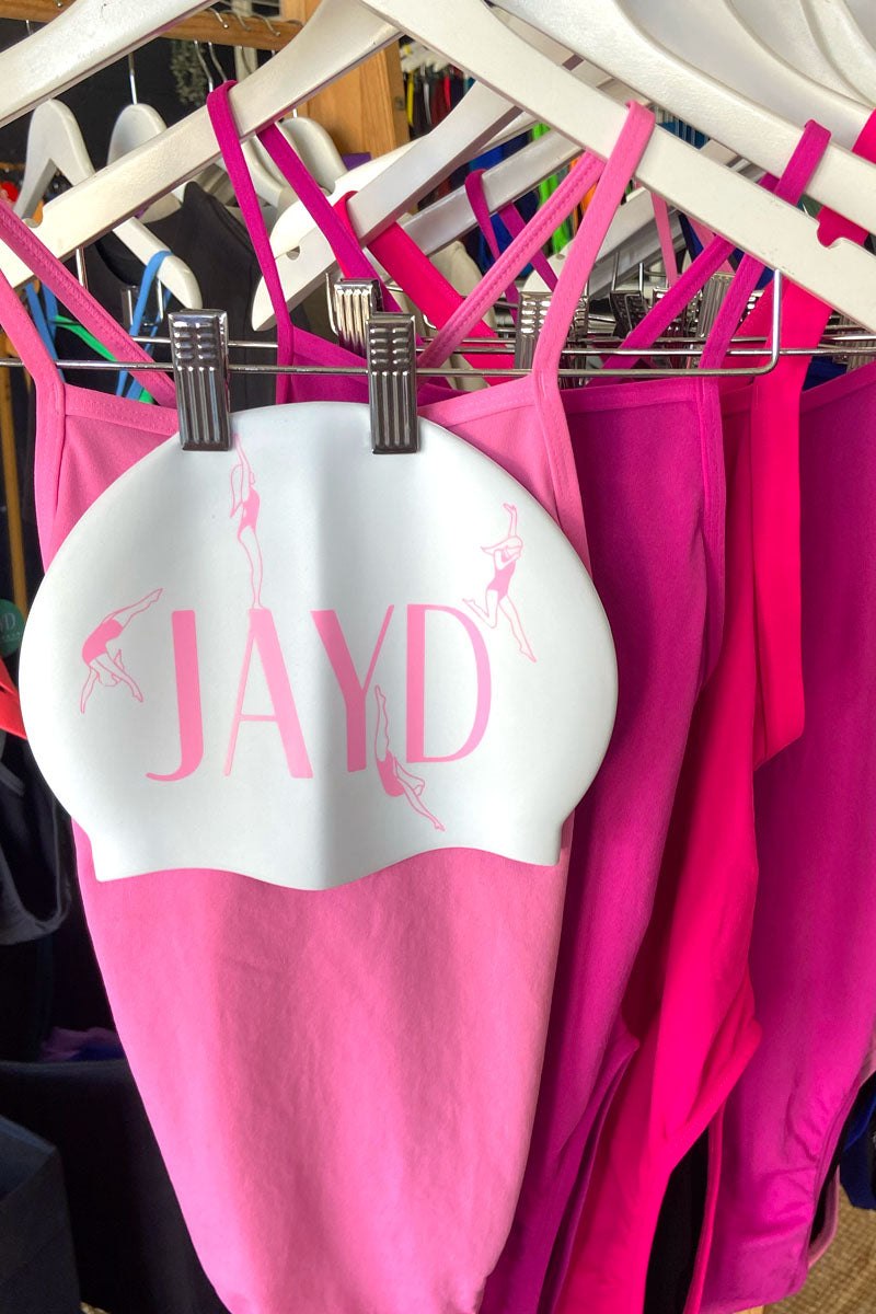 JAYD Swimwear Dive In swim cap against pink JAYD one pieces