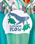 Swim cap design with whale and turtles and 'find your flow' text.