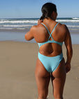 Athlete Sara wears our Siena one piece in the colour Mykonos, it is made with chlorine resistant material and  offers mid-cheek coverage.