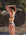 Athlete Molly wears athletic swim bottom by JAYD Swimwear in the colour Carbon. Bikini bottoms is seamless
