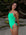JAYD Swimwear Zambia fixed back one piece worn on triathlete Ana. She is wearing the colour Meadow with contrasting Vibe hip cut-out detailing and straps. This piece is made from chlorine resistant material.