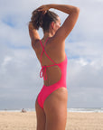 Back view of JAYD Swimwear tie back athletic one piece: Isla in Fiesta