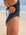 Side view of JAYD Swimwear full coverage tie back athletic one piece: Riva in Black