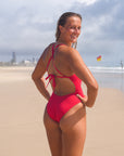 Back view of JAYD Swimwear full coverage tie back athletic one piece: Riva in Ruby 