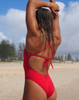 Close view of JAYD Swimwear full coverage tie back athletic one piece: Riva in Ruby 