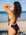 Athlete and designer Madi Armstrong wearing JAYD Swiwmear Ibiza one piece swimsuit in Acai Purple with contrasting Kiwi straps