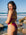 JAYD Swimwear athlete Madi Armstrong wearing JAYD Lennox one piece swimsuit in Tart pink with contrasting Daffodil straps. Madi designed this piece.