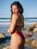 JAYD Swimwear athlete Madi Armstrong wearing JAYD Lennox one piece swimsuit in Tart pink with contrasting Daffodil straps. Madi designed this piece.
