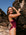 Athlete Molly wears the JAYD swimwear fixed back one piece called Zambia in the colour Sangria. The contrasting cut out straps are neon orange. This piece is designed to stay in place.