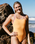 Athlete Emily wears JAYD Swimwear's athletic one piece Lennox. She is wearing the sunshine colour, which is double lined to ensure no see-through scandals.