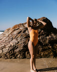 JAYD Swimwear fixed back one piece in the Lennox style, as worn by athlete Emily. She is wearing the sunshine colour with the fairy floss contrast straps