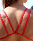 Up close image of the back detailing of JAYD swimwear's athletic one piece Finely in the Ruby colour.