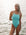 Swimmer Keria wears the Tallow fixed back one piece by JAYD Swimwear in the colour seamist. The Tallow offers full coverage and is made from chorine resistant material