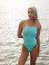 Swimmer Keria wears the Tallow fixed back one piece by JAYD Swimwear in the colour seamist. The Tallow offers full coverage and is made from chorine resistant material