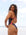 Side view of a female swimmer wearing a JAYD Swimwear Lennox one piece athletic swimsuit in açai purple, with a blurred beach background.