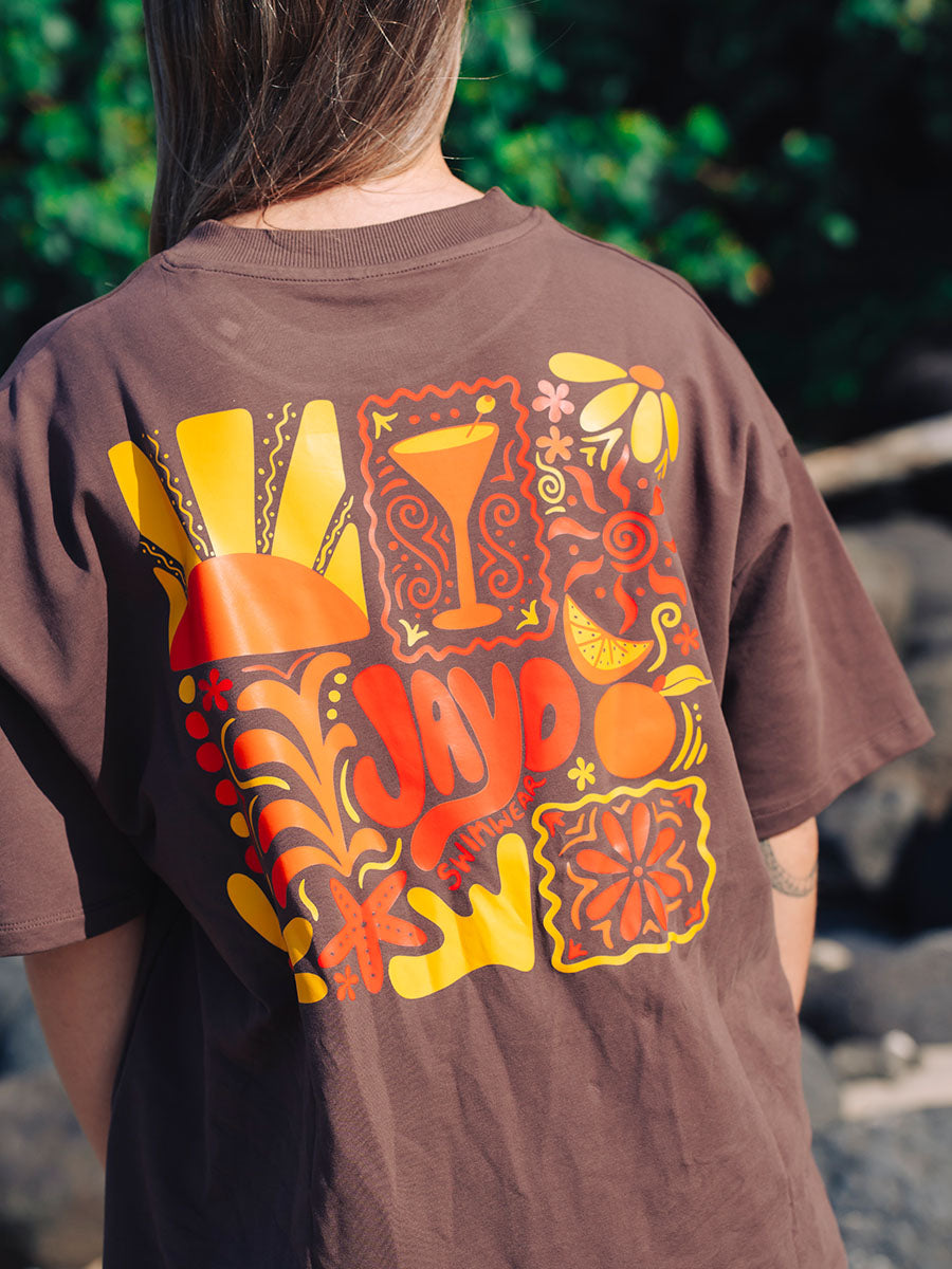 JAYD Swimwear chocolate brown boxy fit t-shirt featuring a groovy orange and yellow JAYD Swimwear word mark on the chest.