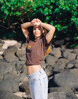 Brown oversized JAYD Swimwear t-shirt with a retro orange and yellow logo print on the front, a boxy fit tee for everyday beach style.
