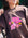 Front view of a model wearing JAYD Swimwear's brown oversized tee, printed with a tropical pink and yellow hibiscus flower graphic.