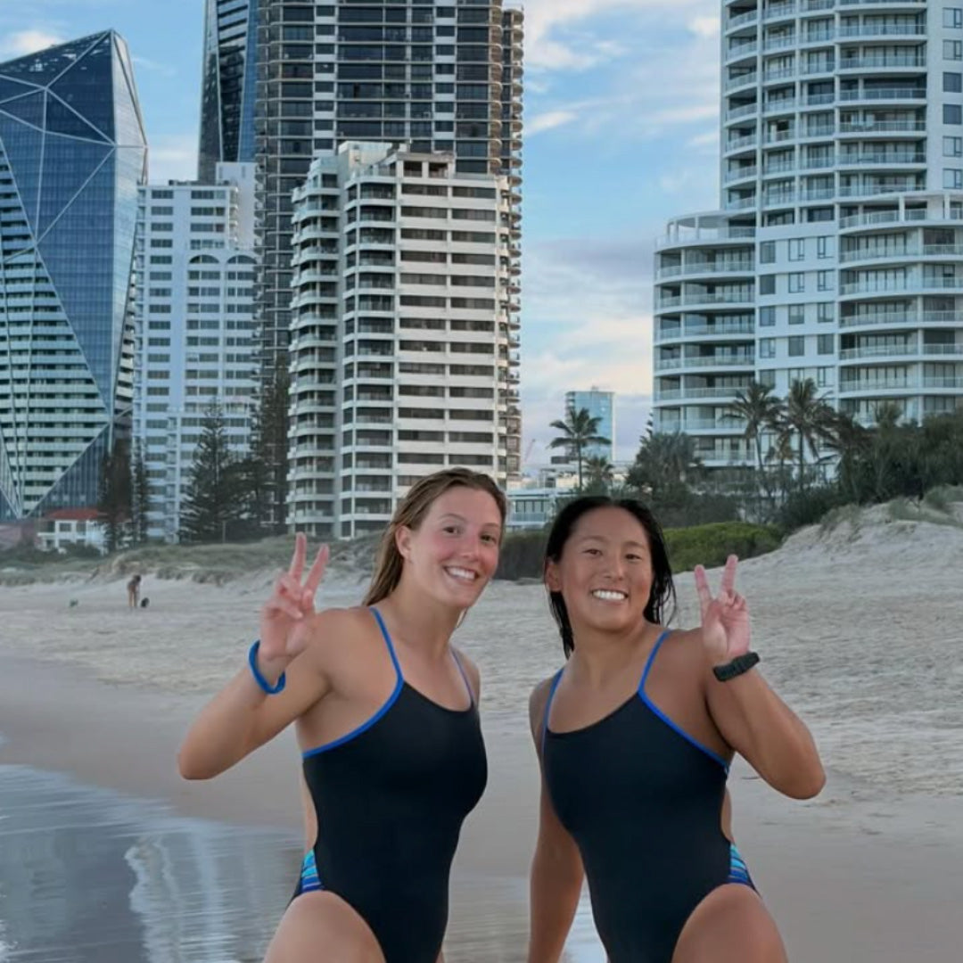 Two women wearing JAYD Swimwear while enjoying time by the ocean.