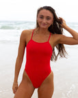 JAYD Swimwear, athletic one piece in the colour ruby. Enjoying the beach.