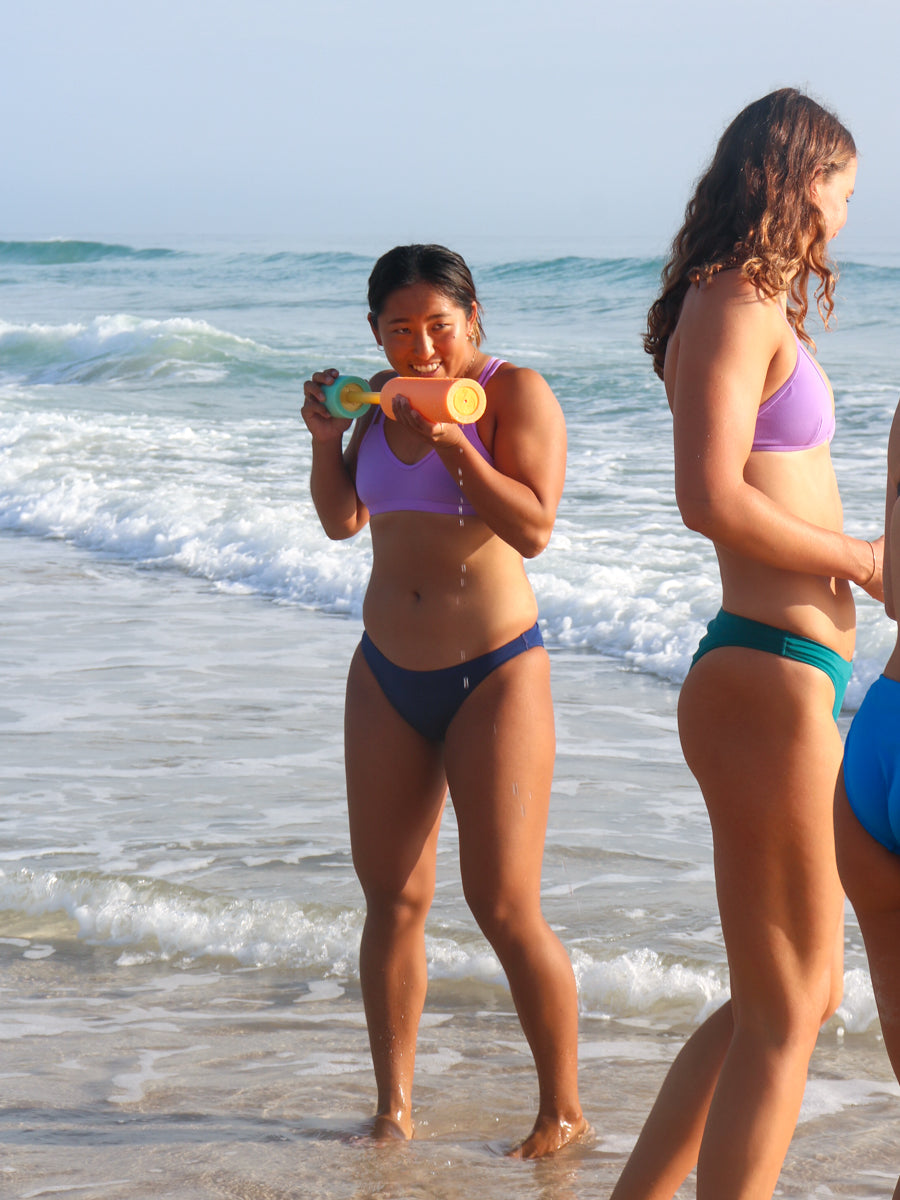 Front view of seamless, athletic, full coverage JAYD Swimwear Cali bikini bottoms in Navy blue.