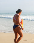 Side view of seamless, athletic, full coverage JAYD Swimwear Cali bikini bottoms in Navy blue.