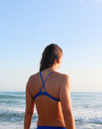 Back view of athletic cross-back JAYD Swimwear Kiama bikini top in Cobalt Blue.