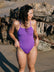Madi wears the Riva one piece by JAYD Swimwear in the colour Murasaki. This piece is built for performance and is a tie-back.