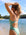 Rear standing view of JAYD Swimwear's full-coverage athletic one-piece Airlie in the shade Matcha.