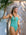 Front view of JAYD Swimwear's full-coverage athletic one-piece Airlie in the shade Matcha.
