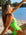 Side view of model sitting on beach wearing JAYD Swimwear athletic one piece Zambia in Splice.
