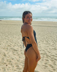 Back view of JAYD Swimwear tie back athletic one piece: Isla in Black