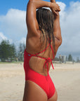 Close back view of JAYD Swimwear tie back athletic full coverage one piece: Riva in Ruby