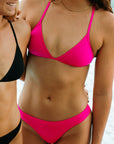 Front view of JAYD Swimwear athletic Triangle training bikini top in Pink Sorbet.