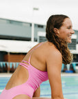 Back strap side view of Airlie One Piece Athletic Swimsuit in Fairy Floss pink by JAYD Swimwear