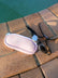 JAYD Swimwear Pink Goggle Bag with goggles on pool deck.