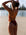 JAYD Swimwear open water swimmer Madi wears the fixed back Lennox one piece in the colour Cinnamon with contrasting sunshine straps and hip cut-outs. This piece offers mid coverage and is comfortable and durable for long training sessions 